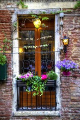 Fototapeta na wymiar Venice Window with Flowers and Lights