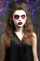 Young woman with Halloween makeup at party
