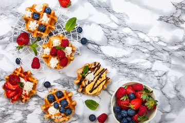 Fototapeta na wymiar Belgian waffles with berries