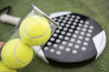 Close up image of paddle tennis balls on tube