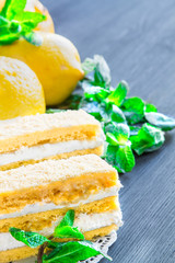 Lemon cake with mint leaves and lemon slices