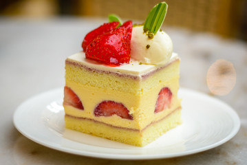 Strawberry Chiffon Entremet cake on white china plate