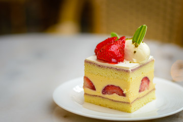 Strawberry Chiffon Entremet cake on white china plate