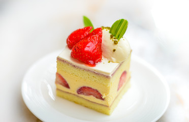 Strawberry Chiffon Entremet cake on white china plate