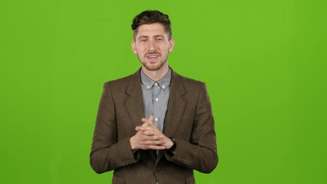 Young Presenter In The Studio Tells The Weather Forecast Correctly. Green Screen