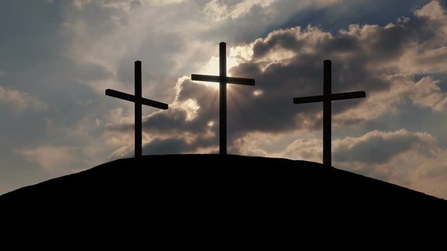 Sun Shines Behind Crosses On Hill