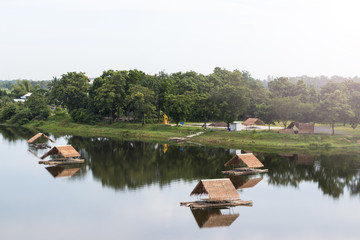 Fototapeta na wymiar Bamboo raft with vetiver roof on the lake.