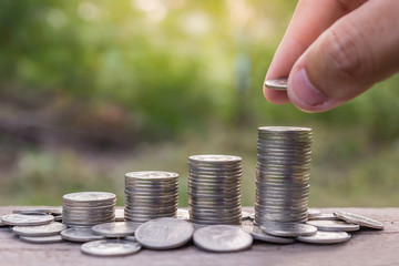 Saving money concept: Man's hand putting money coin stack, Money, Financial, Business Growth concept