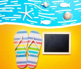 Behangcirkel Summertime flip-flops and copy space board © Simonforstock