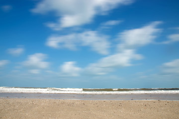 Motion of cloud on the beach in the summer. Out of focus image.