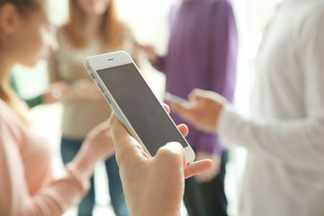 Male hand with smartphone, closeup