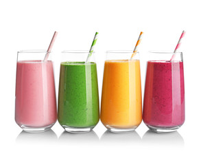 Fruit smoothies with kiwi, blueberry, orange, strawberry flavors on white background