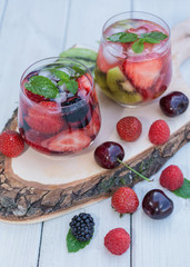 Glasses fruit water with various ingredients