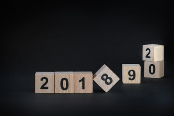 Obraz premium 2018, 2019 and 2020 on black background, happy new year concept and holiday and event idea