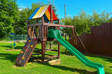 children's climbing frame with slide and climbing wall