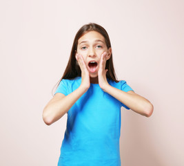Cute surprised girl on color background