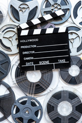 Fototapeta premium Aged vintage super 8 mm film reels and clapper board