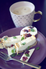 cheese cake dessert with chocolate lollipop and coffee cup