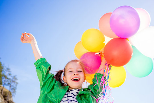 Girl is having fun with balloons
