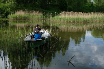 Fishermen in a boat on the lake.