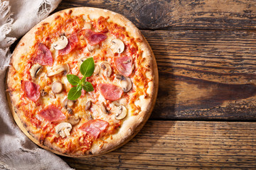 pizza with ham, salami and mushrooms © Nitr