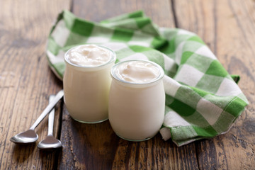 Obraz na płótnie Canvas yogurt in a glass jars