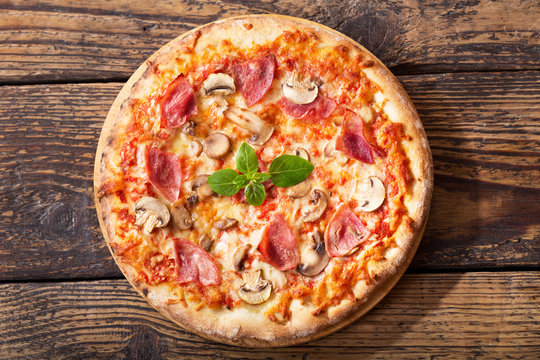 pizza with ham, salami and mushrooms