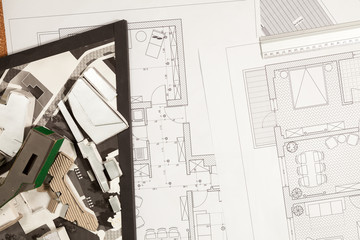 Blueprints and 3D plans on architect table. Construction and architecture. Project and design