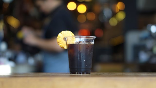 glass of iced coffee on the bar counter, americano coffee