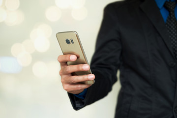 Smartphone in hand.