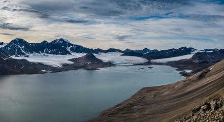 Glaciers and mountain range under the clouds