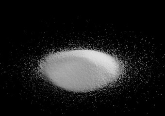 pile salt isolated on black background