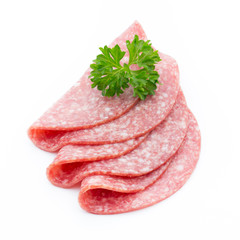 Salami smoked sausages slices isolated on white background.