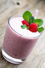 Raspberry milk shake with mint decor.