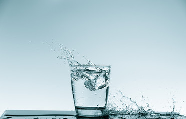 Water splash in glass. Drinking water concept