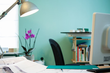 Architect office with blueprints on table. Professional architecture and projects