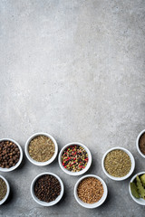 Herbs and spices in white bowls. Top view