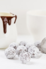Obraz na płótnie Canvas Chocolate truffle with sugar powder