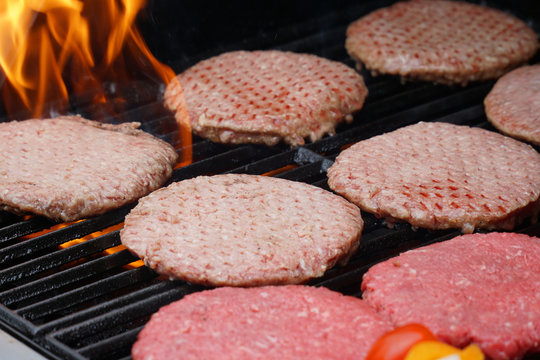 barbecue grill cooking burger steak on the fire