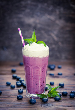 Blueberry milkshake with whipped cream