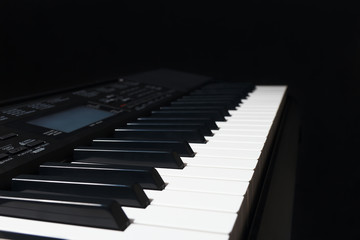 Digital synthesizer on a black background