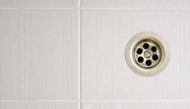 The shower drain with tile floors