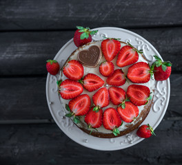 Honey cake with strawberries decor