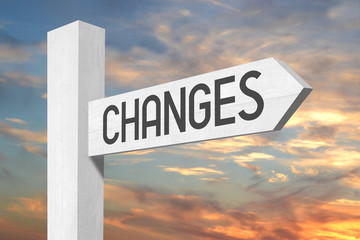 Changes ahead - white wooden signpost with one arrow