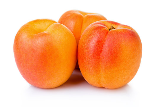 Ripe apricot fruits isolated on white