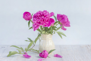 bouquet of purple peony flowers in vase