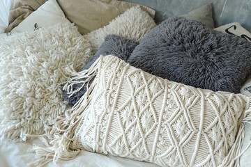 Lot of white and grey pillows for relaxing