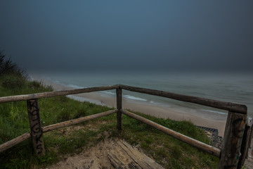 Fototapeta na wymiar Foggy morning at the Baltic sea coast. Jastrzebia Gora, Poland