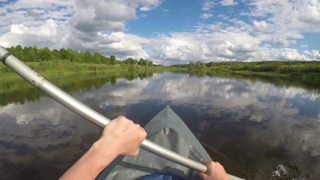 Canoeing on the river Ugra in national resort in the Russian Kaluga Region in June