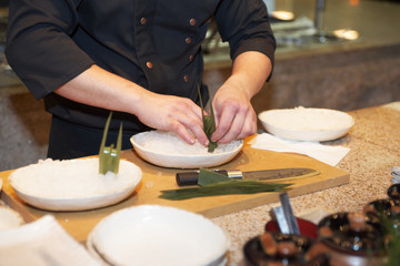 Japanese chef decorating dish
